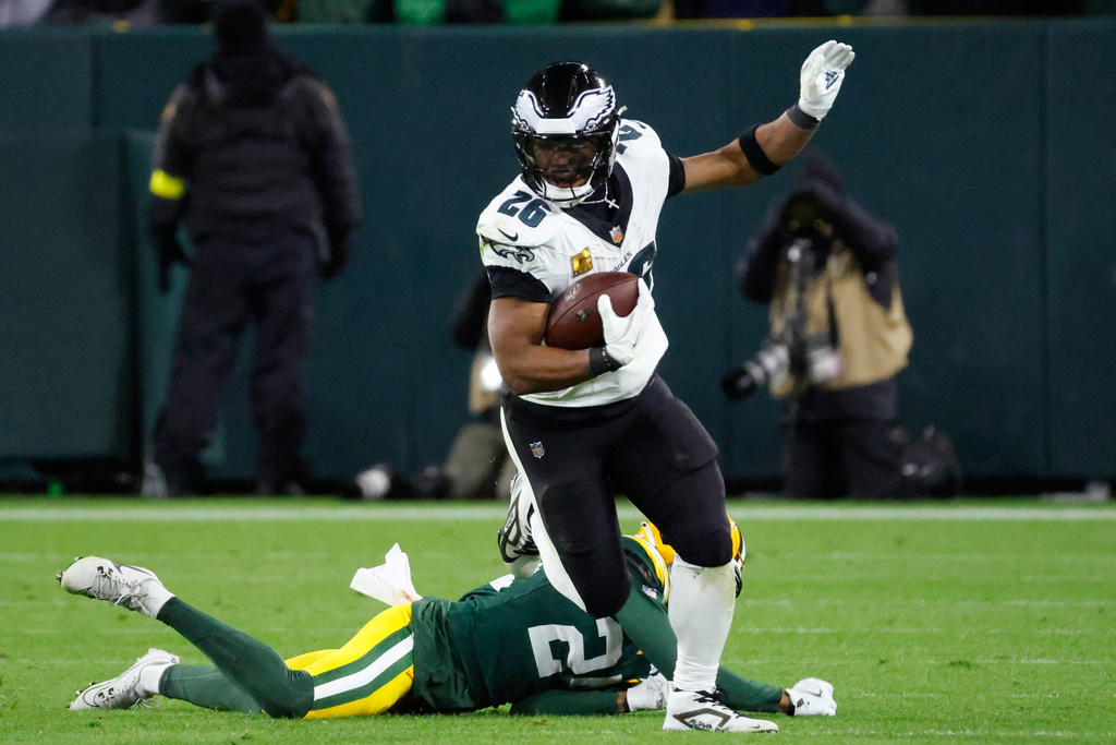 Philadelphia Eagles running back Saquon Barkley (26) runs for a gain against the Green Bay Packers during the second half of an NFL football game Monday, Nov. 10, 2025, in Green Bay, Wis. (AP Photo/Mike Roemer)