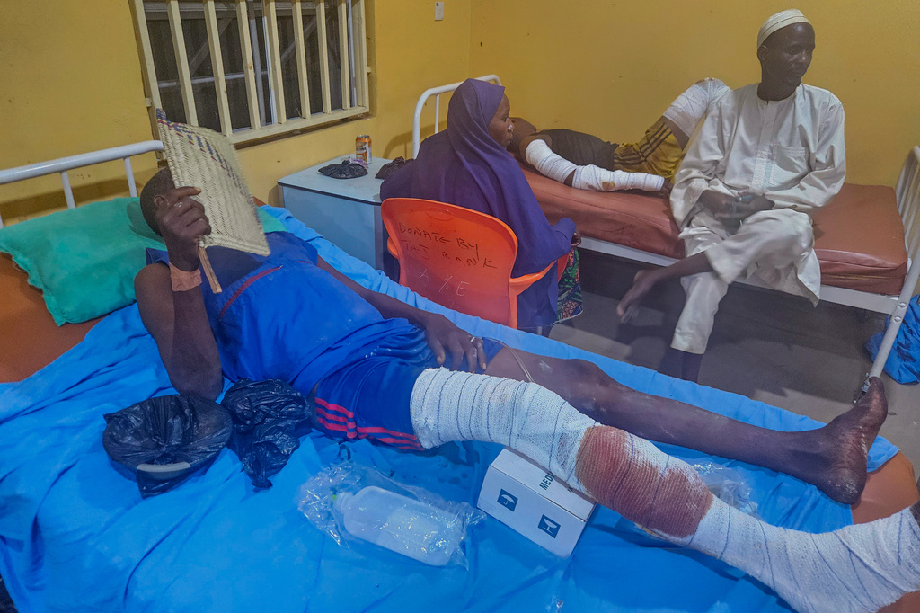 Patients receive treatment at a hospital in Damaturu after Nigerian Air Force strikes targeting jihadi rebels hit a local market Saturday in northeastern Nigeria, Sunday, April 12, 2026. (AP Photo/Micheal Abu)