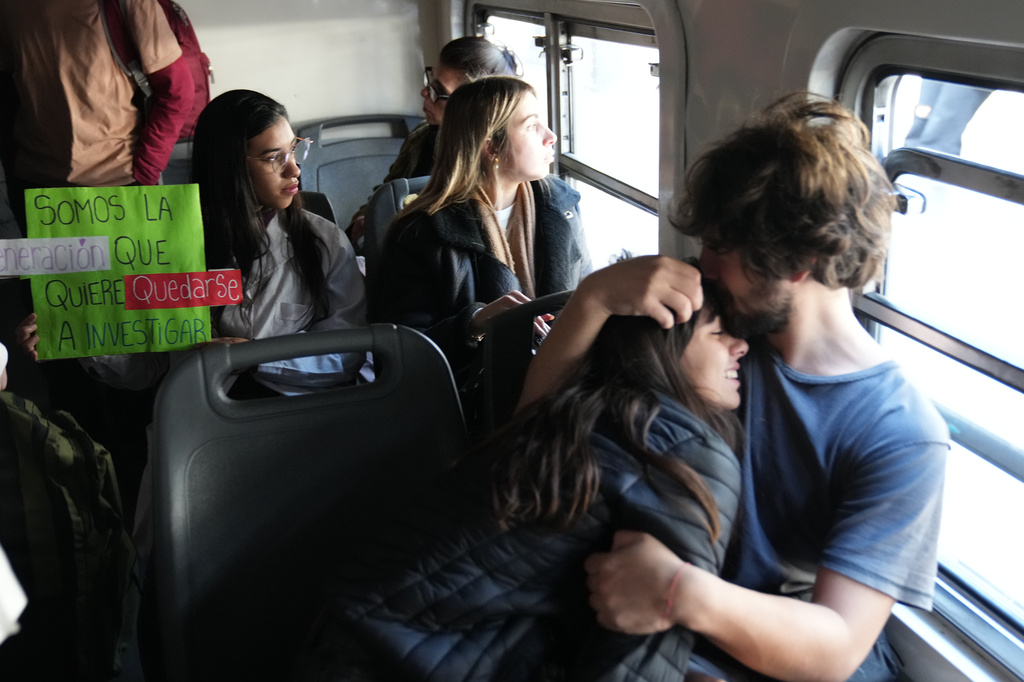 Students ride a train to attend a protest for more public university funding in Buenos Aires, Argentina, Tuesday, May 12, 2026. (AP Photo/Rodrigo Abd)