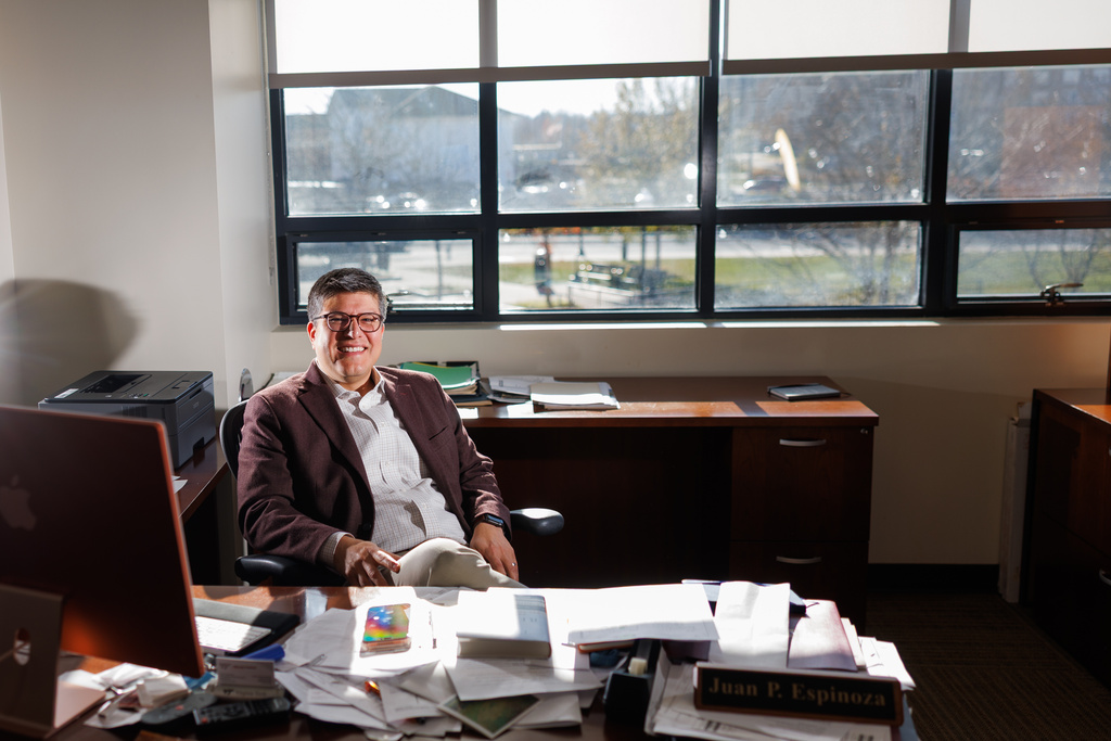 Juan Espinoza, vice provost for enrollment management at Virginia Tech, poses for a photo in his office, Nov. 12, 2025, in Blacksburg, Va. (AP Photo/Shaban Athuman)