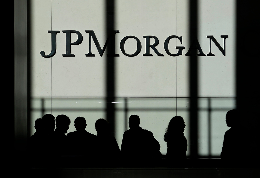 FILE - In this Monday, Oct. 21, 2013, file photo, the JPMorgan Chase & Co. logo is displayed at their headquarters in New York. (AP Photo/Seth Wenig, File)