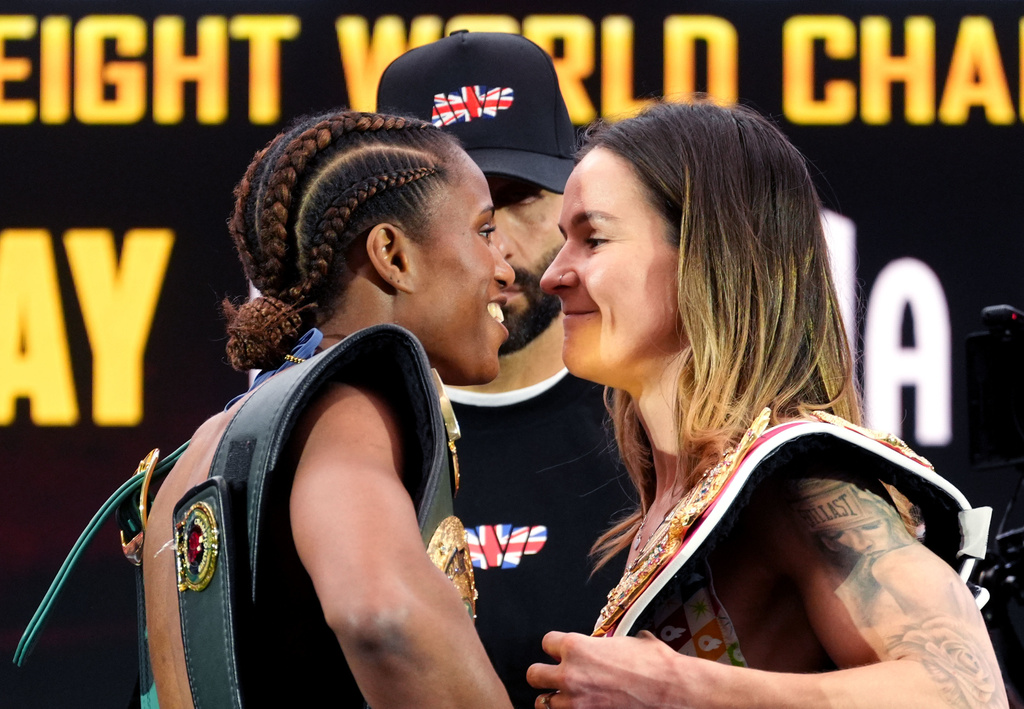 Boxers Caroline Dubois, left and Terri Harper face each other, during a weigh-in ahead of their WBC/WBO women’s lightweight unification fight, in London, Saturday April 4, 2026. (Adam Davy/PA via AP)