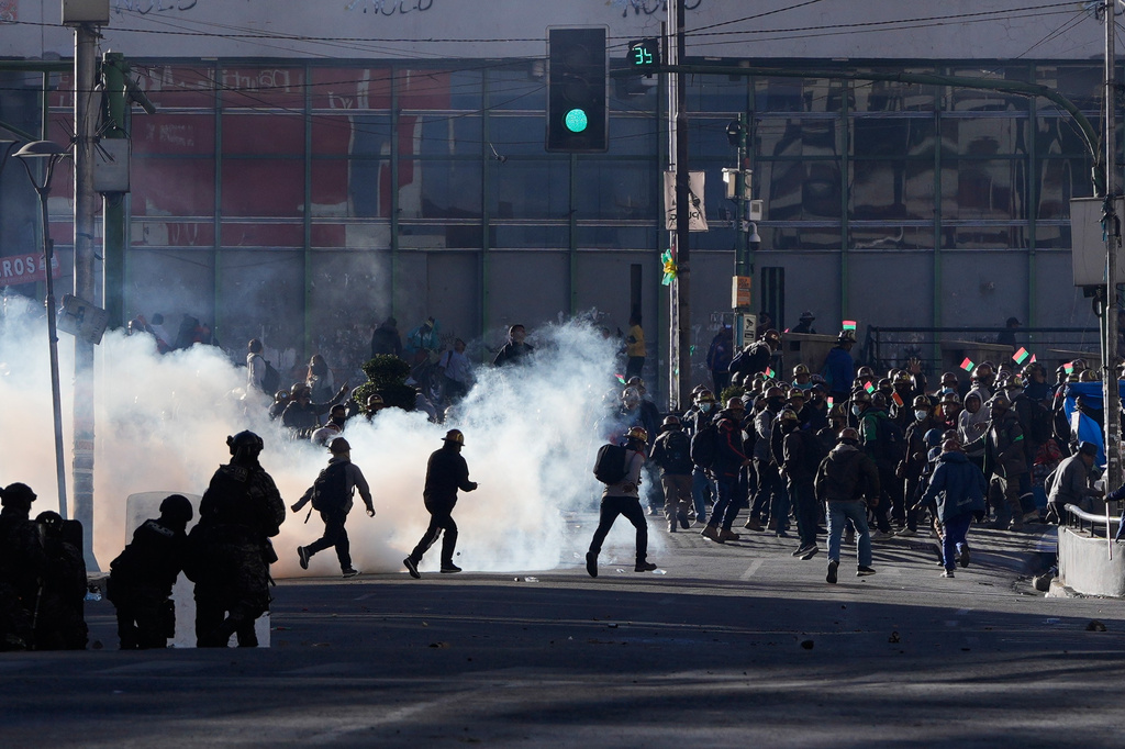 Artisanal minersclash with police during a protest demanding access to expanded mining areas in La Paz, Bolivia, Thursday, May 14, 2026. (AP Photo/Juan Karita)