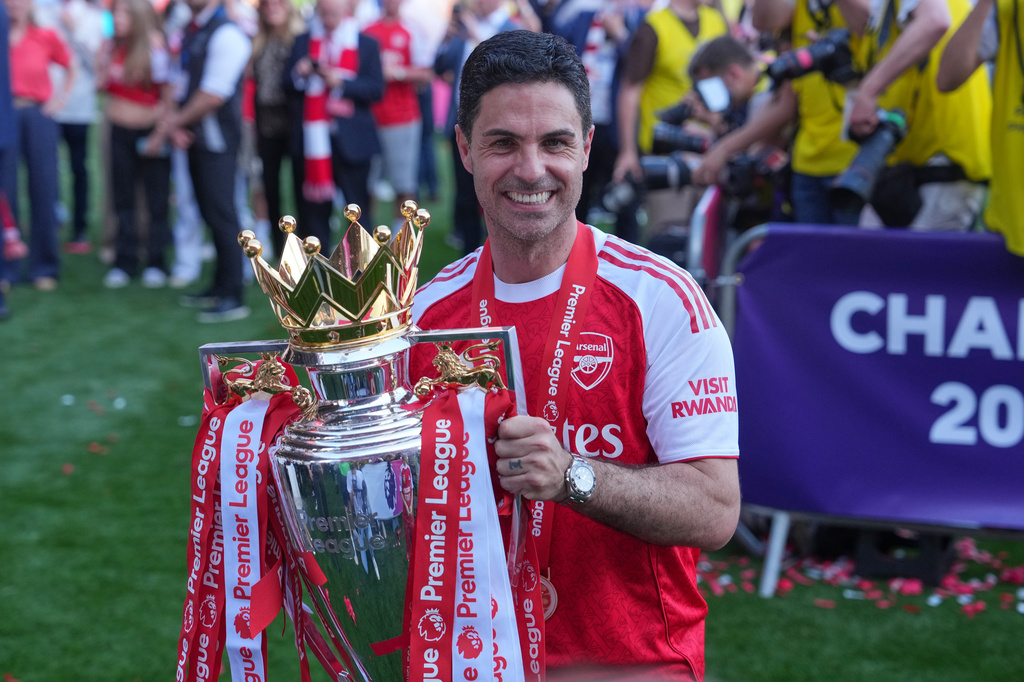 Arsenal's manager Mikel Arteta holds the trophy during celebrating their Premier League title after the English Premier League soccer match between Crystal Palace and Arsenal in London, England, Sunday, May 24, 2026. (AP Photo/Kin Cheung)