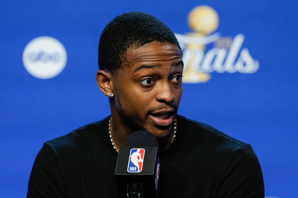 San Antonio Spurs guard De'aaron Fox speaks during a news conference prior to Game 5 of the NBA Finals basketball series against the New York Knicks, Friday, June 12, 2026, in San Antonio. (AP Photo/Ross D. Franklin)