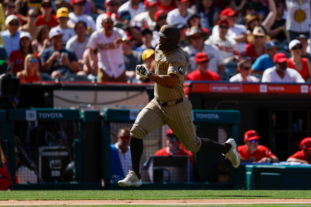 San Diego Padres' Xander Bogaerts (2) runs to home plate to score during the seventh inning of a baseball game against the Los Angeles Angels, Sunday, April 19, 2026, in Anaheim, Calif. (AP Photo/Caroline Brehman)