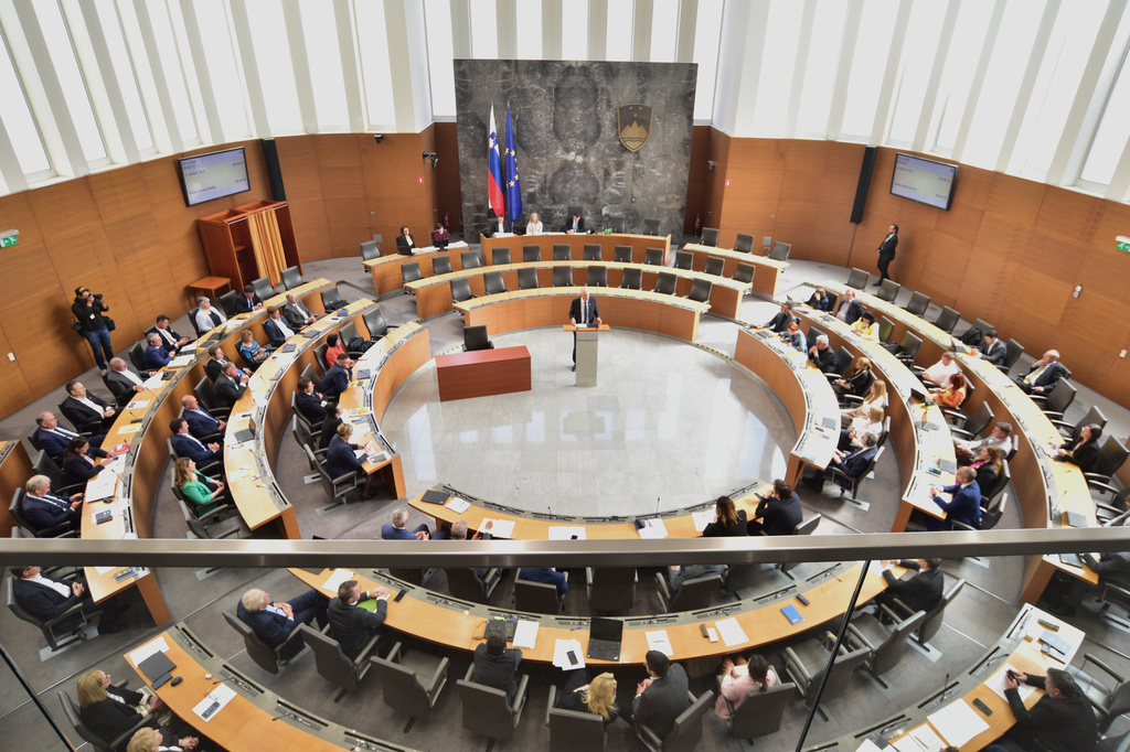 Janez Jansa, center, addresses the Slovenian Parliament during a session in Ljubljana, Slovenia, Friday, May 22, 2026, before appointing him as prime minister, ending a political deadlock after tight elections in March. (AP Photo/Igor Kupljenik)