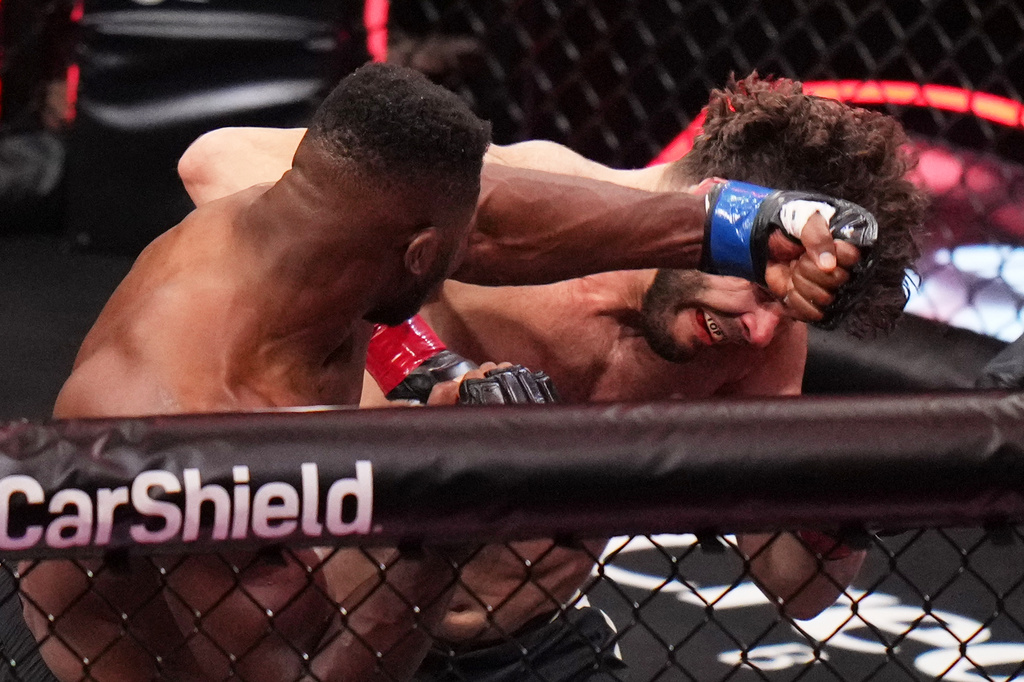 Francis Ngannou, of Cameroon, left, punches Philipe Lins, of Brazil, during their heavyweight mixed martial arts fight Saturday, May 16, 2026, in Inglewood, Calif. (AP Photo/Jae C. Hong )