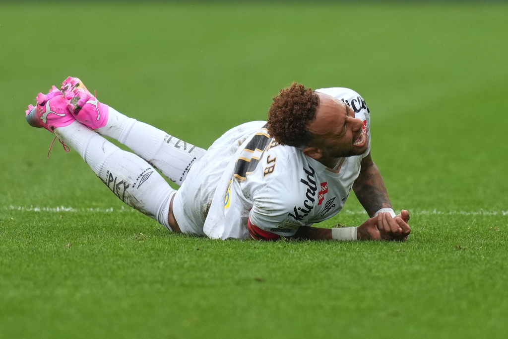 Santos' Neymar grimaces in pain after he was fouled during a Brazilian Championship soccer match against Coritiba in Sao Paulo, Sunday, May 17, 2026. (AP Photo/Andre Penner)