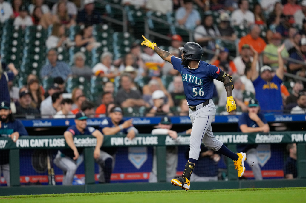 Seattle Mariners' Randy Arozarena celebrates after hitting a two-run home run against the Houston Astros during the second inning of a baseball game Tuesday, May 12, 2026, in Houston. (AP Photo/David J. Phillip)