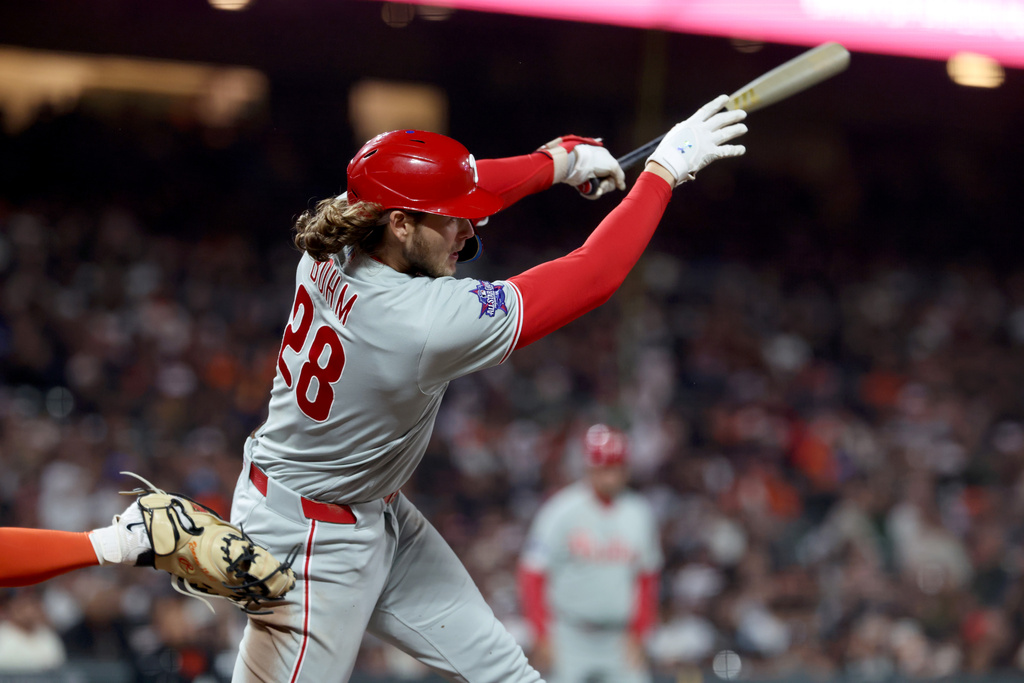 Philadelphia Phillies' Alec Bohm (28) watches his RBI double against the San Francisco Giants during the seventh inning of a baseball game in San Francisco, Monday, April 6, 2026. (AP Photo/Jed Jacobsohn)