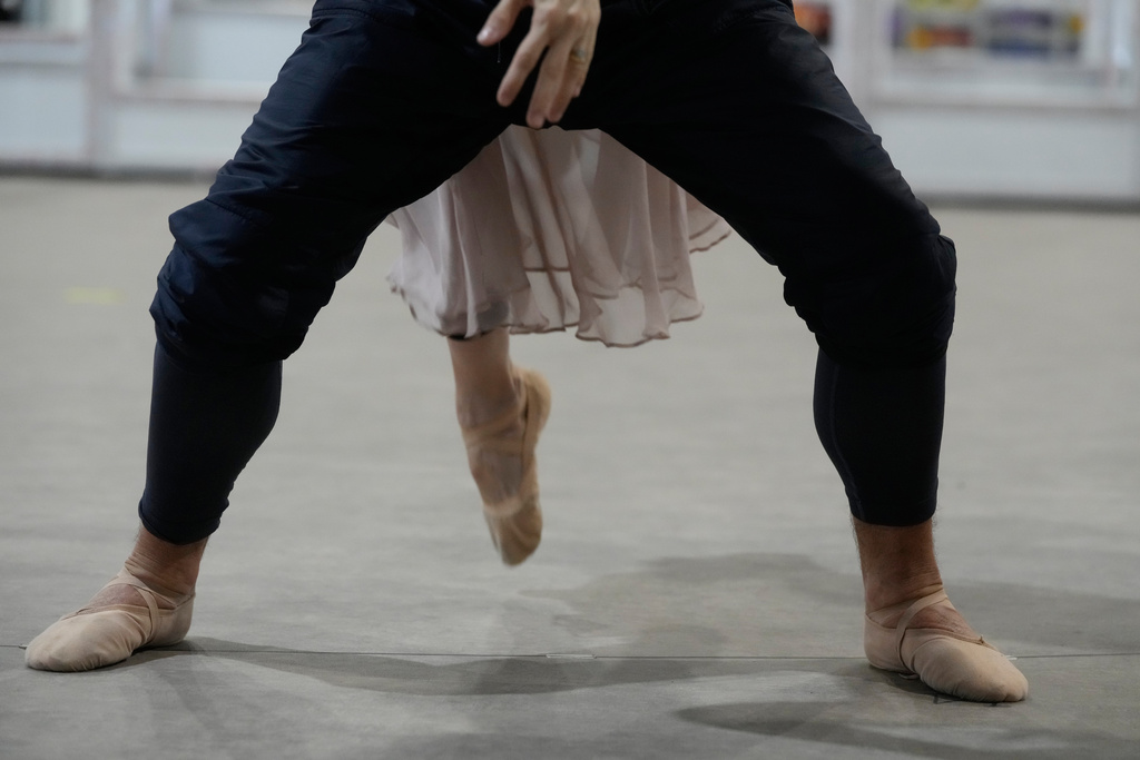 Dancers perform during rehearsals for the opening ceremony of the Milan Cortina 2026 Winter Olympic Games, at a compound in a big tent next to San Siro Stadium, in Milan, Italy, Saturday, Jan. 24, 2026. (AP Photo/Luca Bruno)