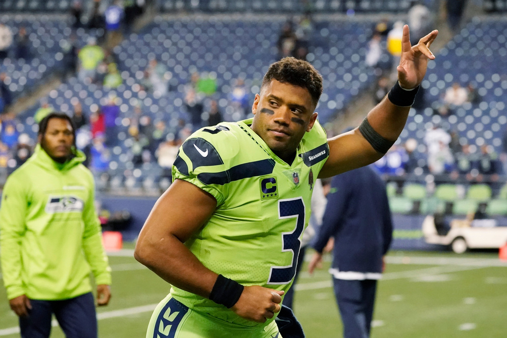 FILE - Seattle Seahawks quarterback Russell Wilson waves to fans as he leaves the field after an NFL football game against the Los Angeles Rams, Oct. 7, 2021, in Seattle. (AP Photo/Elaine Thompson, File)