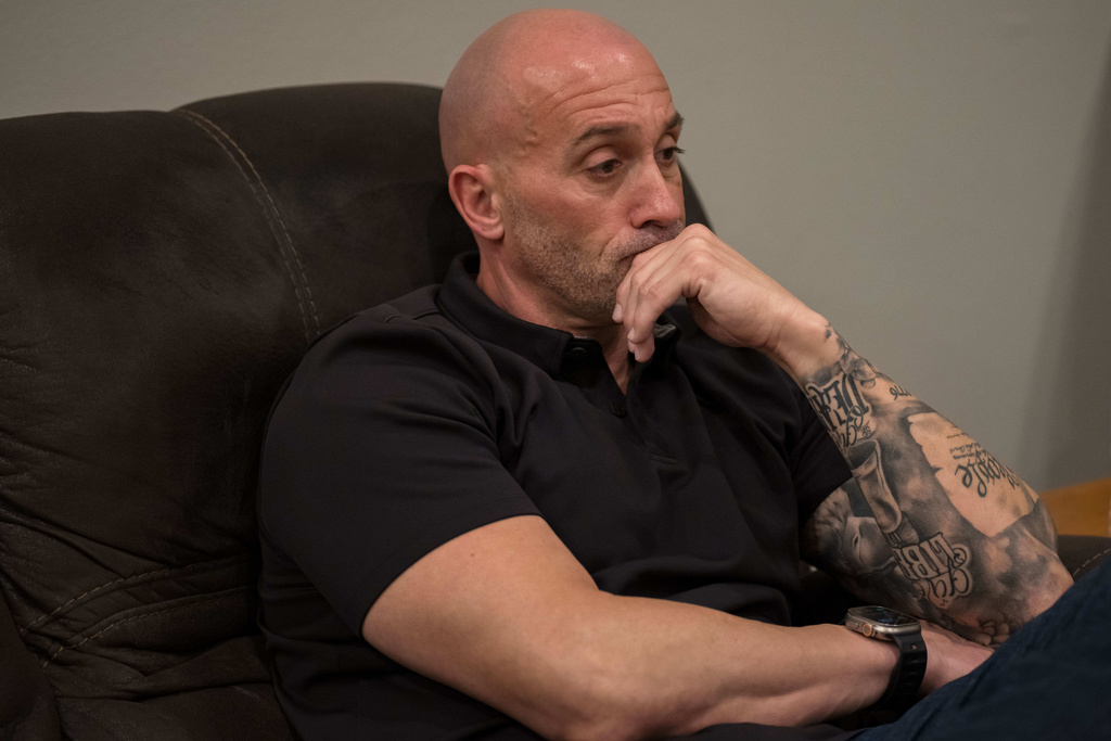 Joseph "Tucker" Daniels listens to lawyers at his home in Thibodaux, La., Thursday, Nov. 13, 2025. (AP Photo/Matthew Hinton)