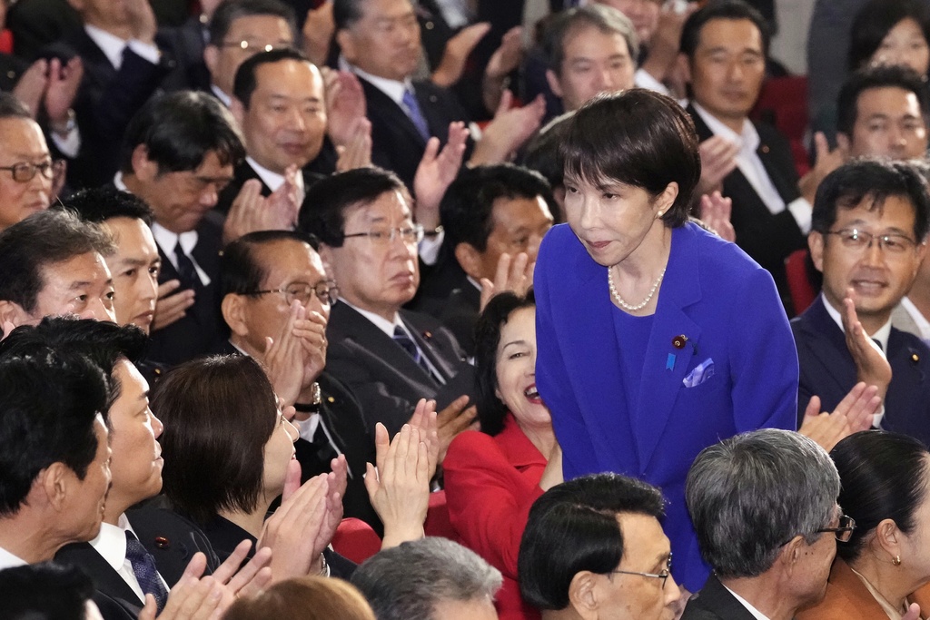 FILE - Former Economic Security Minister Sanae Takaichi, center right, bows as Takaichi was chosen as the new leader of Japan's ruling Liberal Democratic Party during the party's leadership election in Tokyo, Japan, Oct. 4, 2025. (Kyodo News via AP, File)