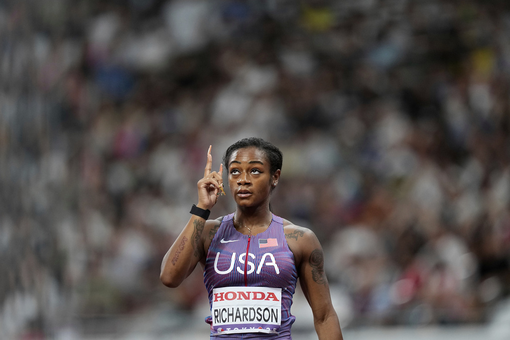 United States' Sha'Carri Richardson gestures after finishing a women's 100 meters heat at the World Athletics Championships in Tokyo, Saturday, Sept. 13, 2025. (AP Photo/Petr David Josek)