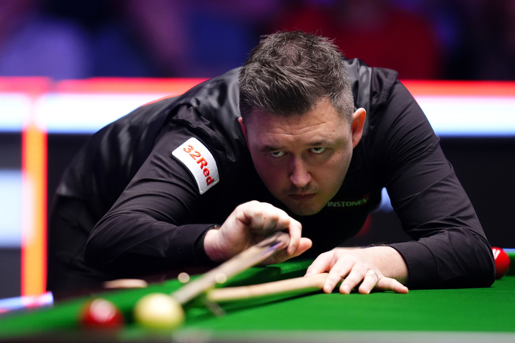 England's Kyren Wilson in action against Scotland's John Higgins during the final of the 2026 Masters Snooker at Alexandra Palace, London, Sunday Jan. 18, 2026. (John Walton/PA via AP)