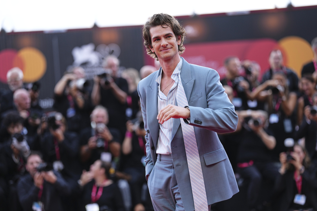 Andrew Garfield poses for photographers on the red carpet for the film 'After the Hunt' during the 82nd edition of the Venice Film Festival in Venice, Italy, on Friday, Aug. 29, 2025. (Photo by Scott A Garfitt/Invision/AP)