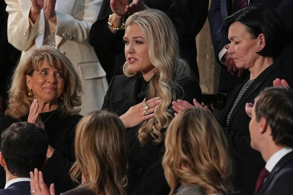 Erika Kirk gestures as President Donald Trump delivers the State of the Union address to a joint session of Congress in the House chamber at the U.S. Capitol in Washington, Tuesday, Feb. 24, 2026. (AP Photo/Matt Rourke)