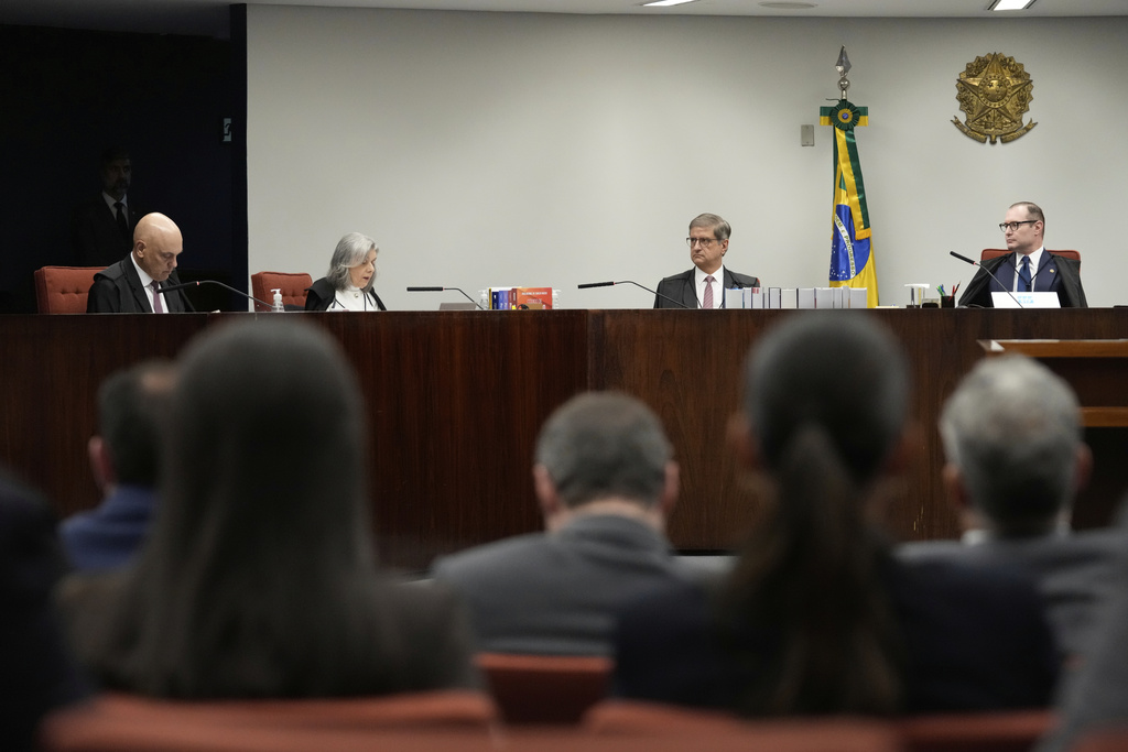 Justices of the Brazilian Supreme Court meet for the verdict and sentencing phase of a trial for those charged in an alleged coup plot to keep Brazil's former President Jair Bolsonaro in office after his 2022 election defeat, in Brasilia, Brazil, Thursday, Sept. 11, 2025. (AP Photo/Eraldo Peres)