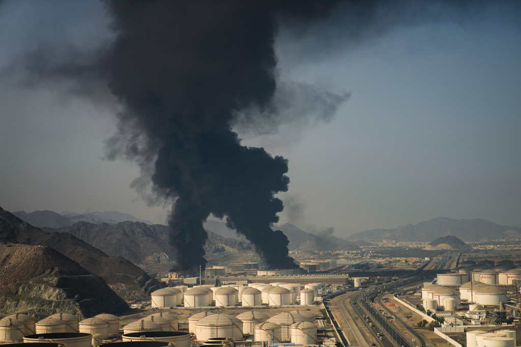 Plumes of smoke rise from an oil facility in Fujairah, United Arab Emirates, Saturday, March 14, 2026. (AP Photo/Altaf Qadri)
