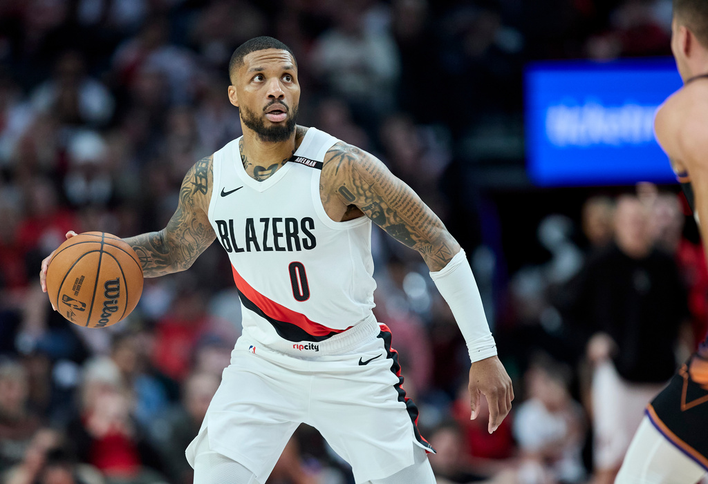 Portland Trail Blazers guard Damian Lillard looks up at the clock against the Phoenix Suns during the second half of an NBA basketball game in Portland, Ore., Wednesday, Oct. 21, 2026. (AP Photo/Craig Mitchelldyer)