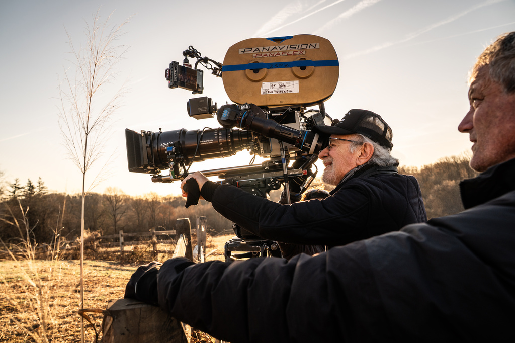 This image released by Universal Pictures shows director Steven Spielberg, center, on the set of "Disclosure Day." (Niko Tavernise/Universal Pictures and Amblin Entertainment via AP)