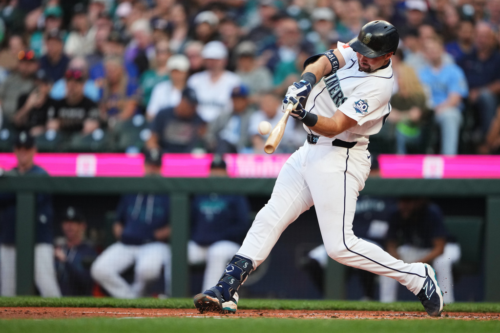 Seattle Mariners' Cal Raleigh hits a two-run home run against the Philadelphia Phillies during the first inning of a baseball game, Monday, Aug. 24, 2026, in Seattle. (AP Photo/Lindsey Wasson)