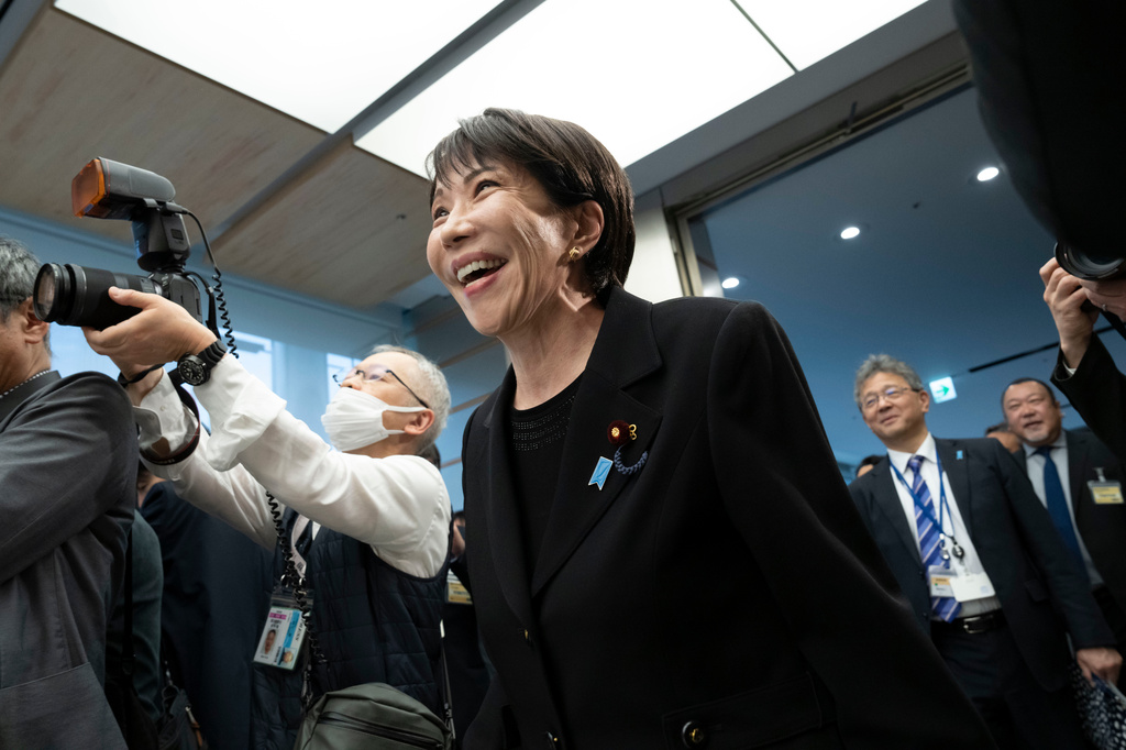 Japan's Prime Minister Sanae Takaichi, arrives for a meeting with members of British rock band Deep Purple at the Prime Minister's Office in Tokyo, Friday, April 10, 2026. (Yuichi Yamazaki/Pool Photo via AP)