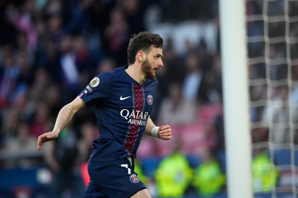 PSG's Khvicha Kvaratskhelia celebrates after scoring during the French League One soccer match between Paris Saint-Germain and Nantes in Paris, France, Wednesday, April 22, 2026. (AP Photo/Michel Euler)