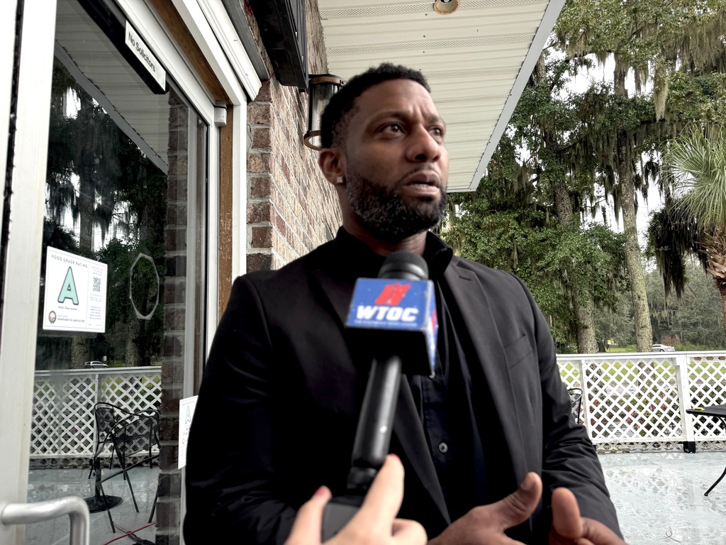 Owner Willie Turral talks to the media outside of Willie's Bar and Grill in St Helena Island, S.C. after a shooting occurred early Sunday, Oct. 12, 2025. (AP Photo/Lewis M. Levine)