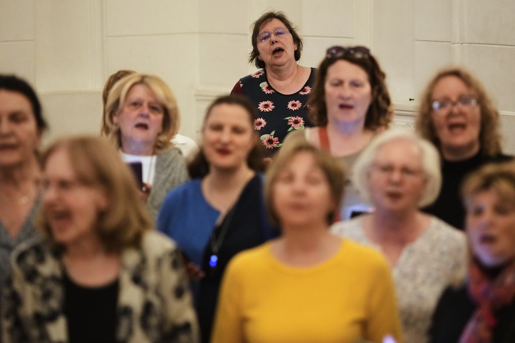 Choir members perform a song during a practice in Belgrade, Serbia, Wednesday, April 15, 2026. (AP Photo/Darko Vojinovic)