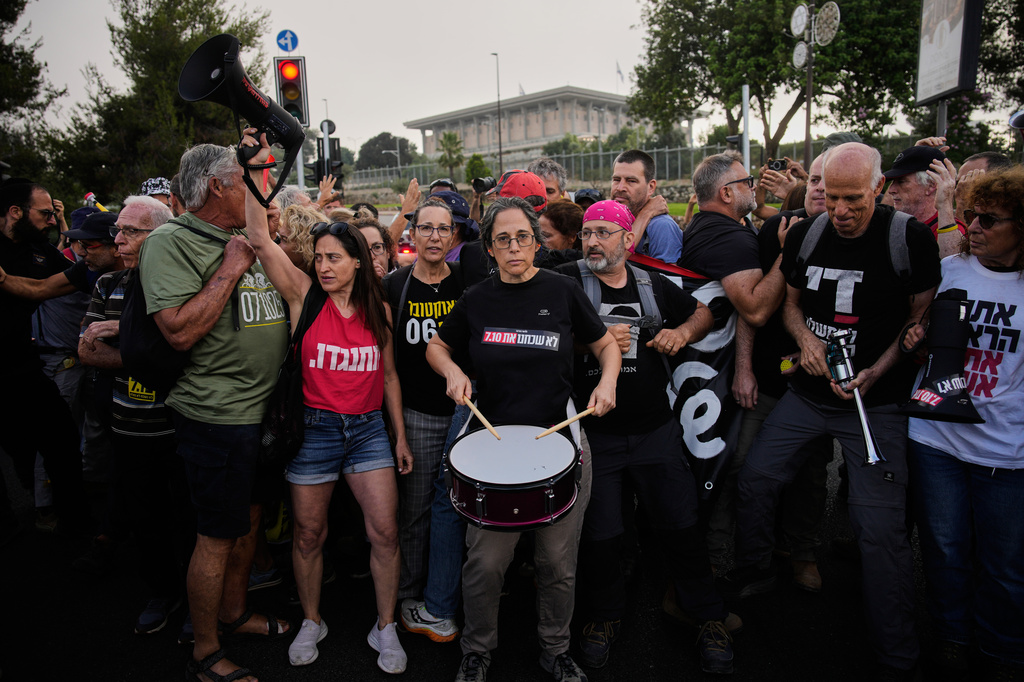 People protest outside the Knesset, Israel's parliament, in Jerusalem, marking 1,000 days since the Oct. 7, 2023, Hamas-led attack on Israel, Thursday, July 2, 2026. (AP Photo/Ohad Zwigenberg)
