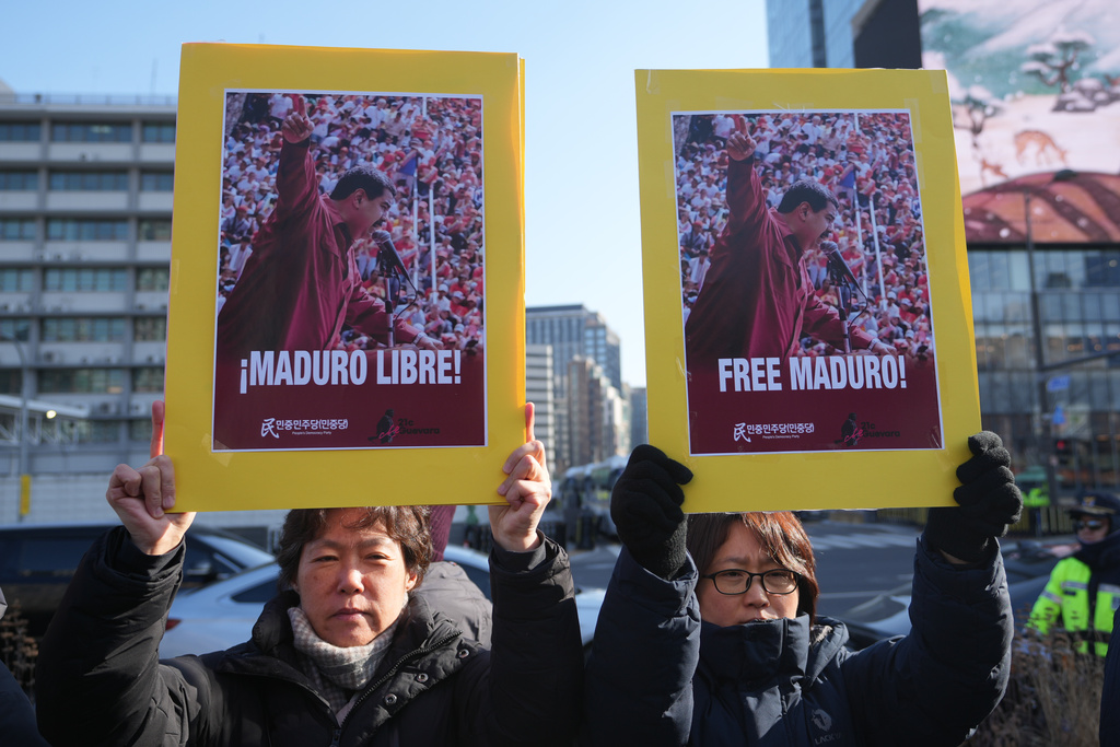 Protesters hold posters during a rally denouncing the U.S. government and President Donald Trump after the U.S. captured Venezuelan President Nicolás Maduro, near the U.S. Embassy in Seoul, South Korea, Monday, Jan. 5, 2026. (AP Photo/Lee Jin-man)