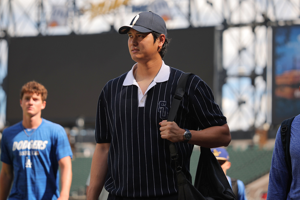 Los Angeles Dodgers' Shohei Ohtani enters the field prior to a baseball game against the Chicago White Sox, Friday, June 12, 2026, in Chicago. (AP Photo/Melissa Tamez)