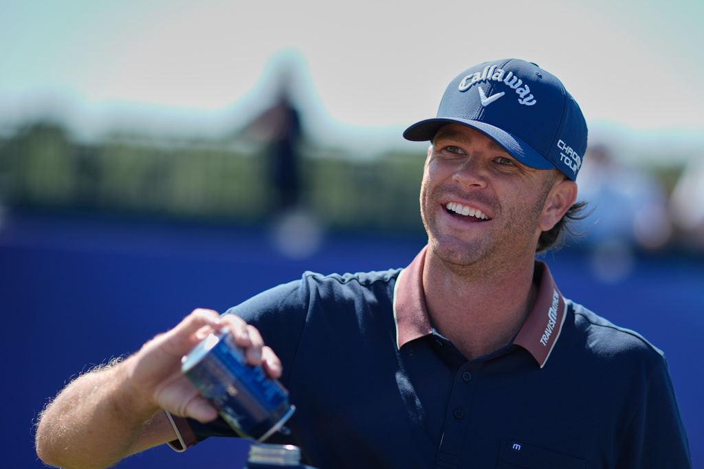 Marcus Plunkett of the United States fills his water bottle on the 15th hole during a practice round for the British Open Golf championships at Royal Birkdale golf club, in Southport, England, Tuesday, July 14, 2026. (AP Photo/David Goldman)