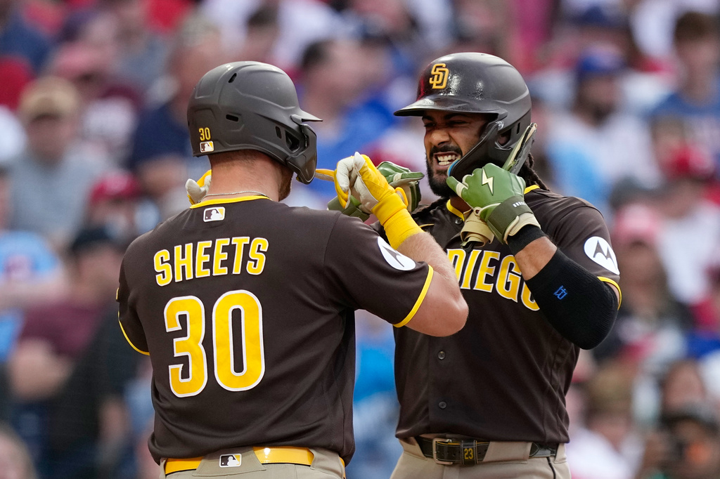San Diego Padres' Fernando Tatis Jr., right, and Gavin Sheets celebrate after Sheets' two-run home run against Philadelphia Phillies pitcher Aaron Nola during the third inning of a baseball game Tuesday, June 2, 2026, in Philadelphia. (AP Photo/Matt Slocum)