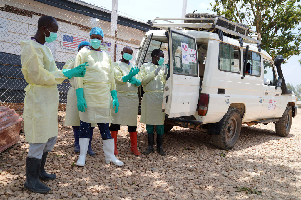 Health workers who are members of the safe and dignified burial team prepare to bury Abineno Justine, a 38 year old woman who died of the Ebola virus, in Bunia, Congo, Friday, Sept. 4, 2026. (AP Photo/Dieudonne Dirole)