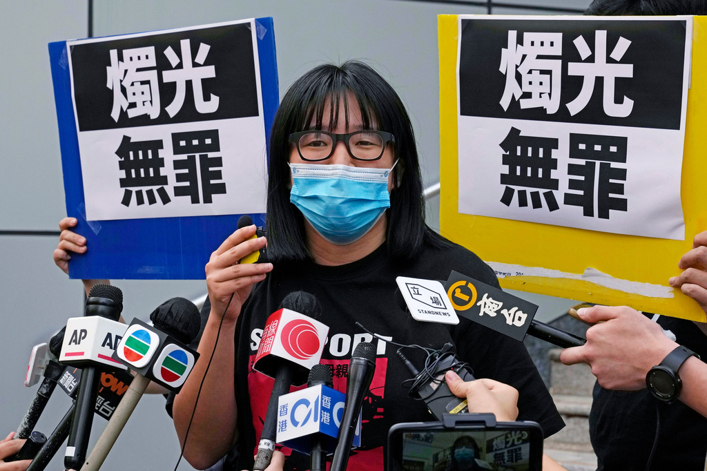 FILE - Chow Hang-tung, then Vice Chairperson of the Hong Kong Alliance in Support of the Democratic Patriotic Movements of China, leaves after being released on bail at a police station in Hong Kong on June 5, 2021. Sign reads "Candle light not a crime" (AP Photo/Kin Cheung, File)