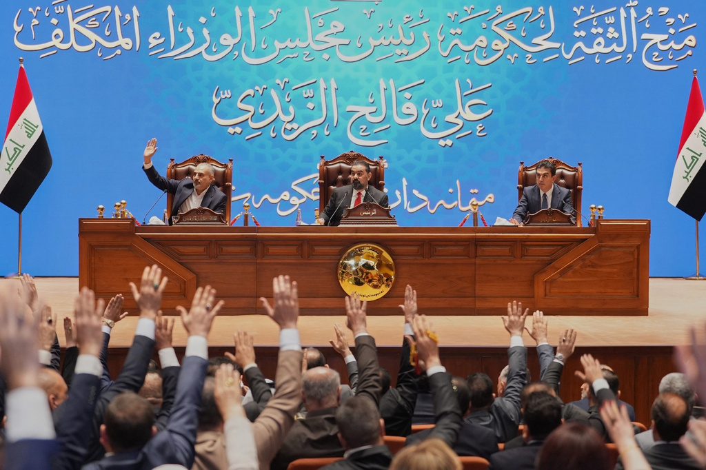 Iraqi lawmakers attend the session to approve the new government in Baghdad, Iraq, Thursday, May 14, 2026. (Iraqi Presidency Office via AP)