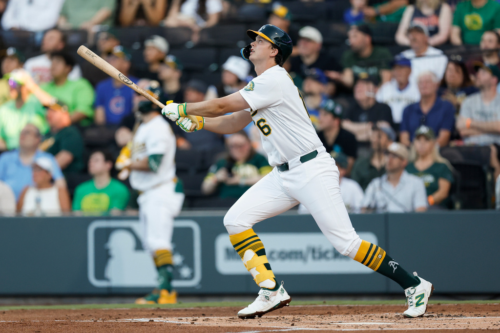 Athletics' Nick Kurtz (16) watches the ball as he hits a solo home run during the first inning of a baseball game against the Milwaukee Brewers, Tuesday, June 9, 2026, in Las Vegas. (AP Photo/Caroline Brehman)