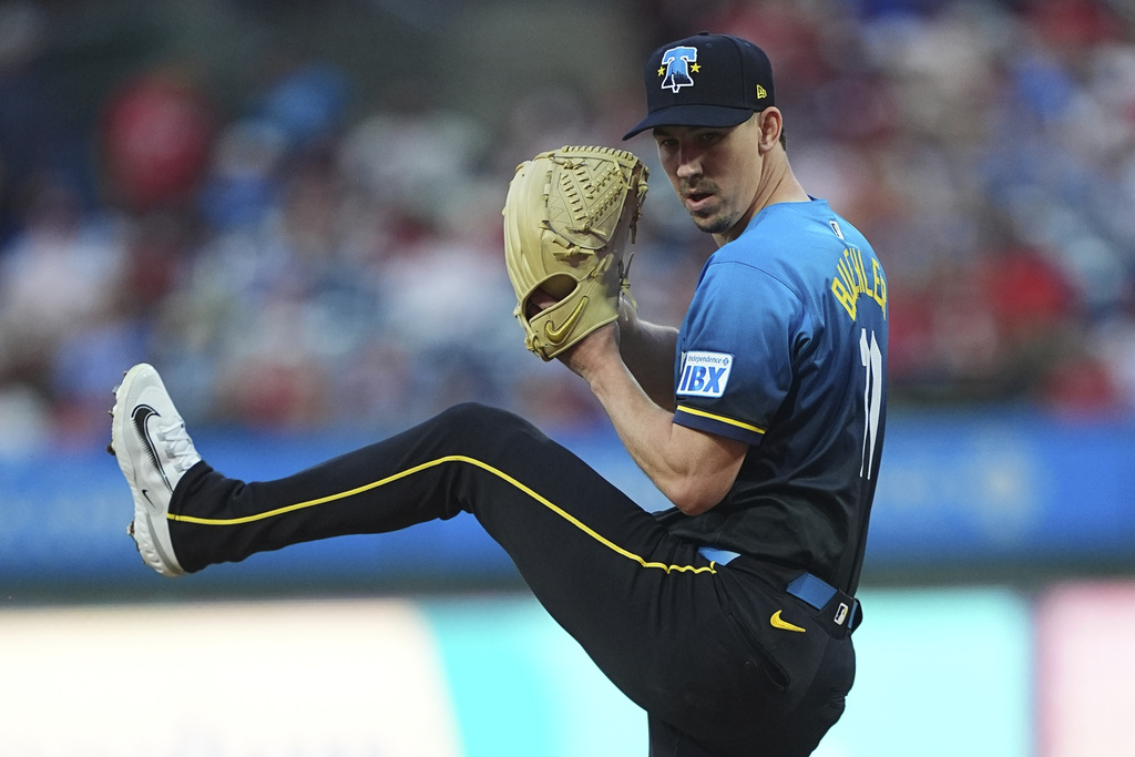 Philadelphia Phillies' Walker Buehler winds up to pitch during the first inning of a baseball game against the Kansas City Royals, Friday, Sept. 12, 2025, in Philadelphia. (AP Photo/Matt Rourke)