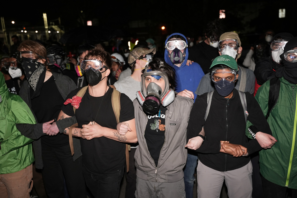 Protesters confront federal immigration officers outside Delaney Hall detention center Thursday, May 28, 2026, in Newark, N.J. (AP Photo/Angelina Katsanis)