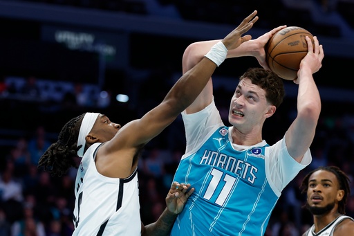 Charlotte Hornets center Ryan Kalkbrenner (11) shoots against Brooklyn Nets guard Terance Mann during the first half of an NBA basketball game in Charlotte, N.C., Wednesday, Oct. 22, 2025. (AP Photo/Nell Redmond) Charlotte Hornets center Ryan Kalkbrenner (11) shoots against Brooklyn Nets guard Terance Mann during the first half of an NBA basketball game in Charlotte, N.C., Wednesday, Oct. 22, 2025. (AP Photo/Nell Redmond)