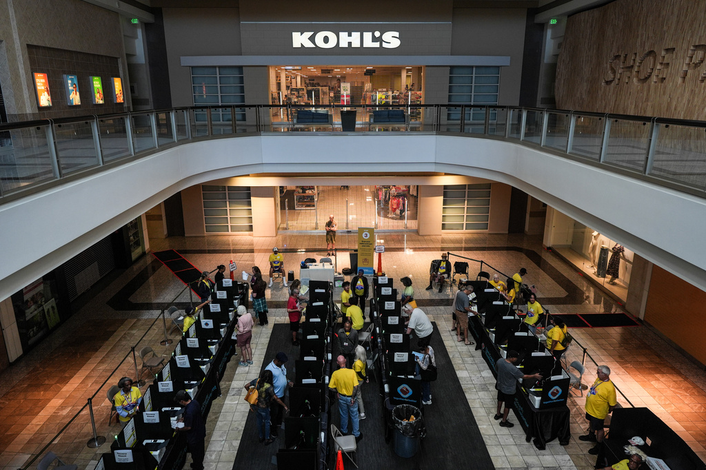 People cast their ballots at a vote center set up inside a shopping mall Tuesday, June 9, 2026, in Henderson, Nev. (AP Photo/Jae C. Hong)