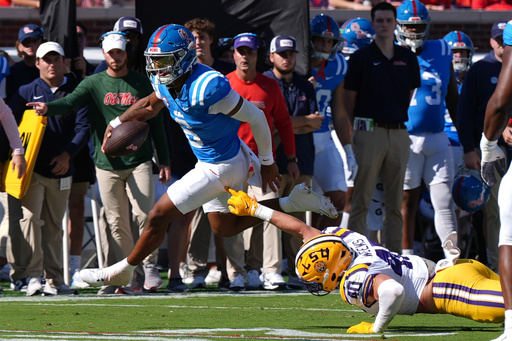 Mississippi quarterback Trinidad Chambliss (6) evades a tackle attempt by LSU linebacker Whit Weeks (40) during the first half of an NCAA college football game in Oxford, Miss., Saturday, Sept. 27, 2025. (AP Photo/Rogelio V. Solis) Mississippi quarterback Trinidad Chambliss (6) evades a tackle attempt by LSU linebacker Whit Weeks (40) during the first half of an NCAA college football game in Oxford, Miss., Saturday, Sept. 27, 2025. (AP Photo/Rogelio V. Solis)