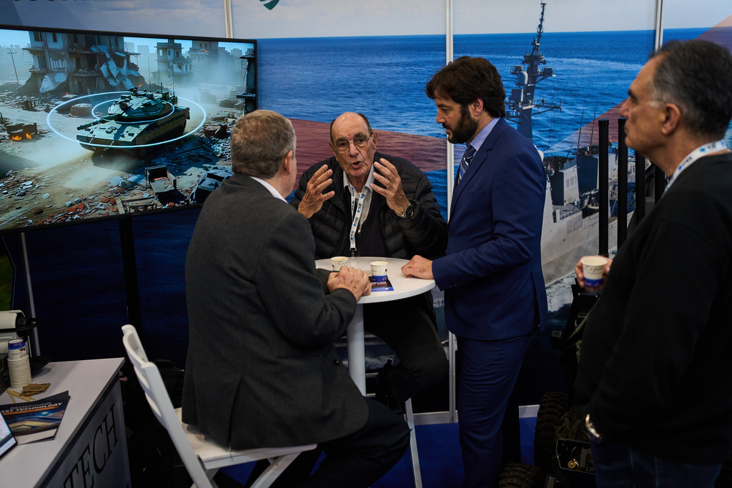Visitors attend a defense industry exhibition in Tel Aviv, Israel, Tuesday, Feb. 17, 2026. (AP Photo/Oded Balilty)