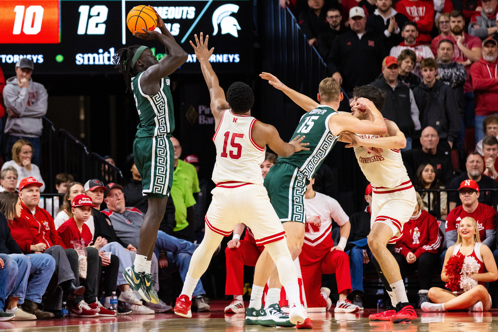 Michigan State guard Kur Teng (2) shoots the ball against Nebraska forward Jared Garcia (15) during the first half of an NCAA college basketball game, Friday, Jan. 2, 2026, in Lincoln, Neb. (AP Photo/Bonnie Ryan)