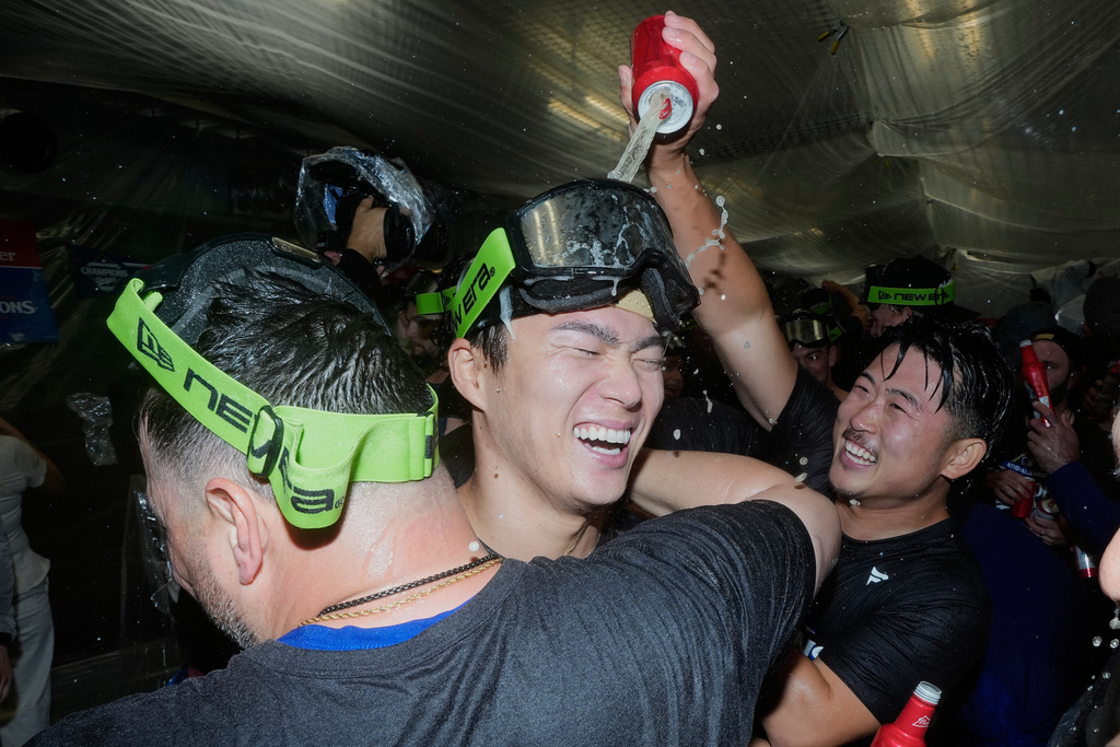 Los Angeles Dodgers pitcher Yoshinobu Yamamoto celebrates their win against the Milwaukee Brewers in baseball's National League Championship Series, Friday, Oct. 17, 2025, in Los Angeles.(AP Photo/Ashley Landis)