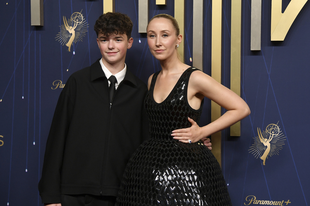Owen Cooper, left, and Erin Doherty arrive at the 77th Primetime Emmy Awards on Sunday, Sept. 14, 2025, at the Peacock Theater in Los Angeles. (Photo by Richard Shotwell/Invision/AP)